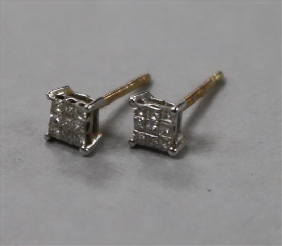 A pair of yellow metal and square diamond cluster ear studs.